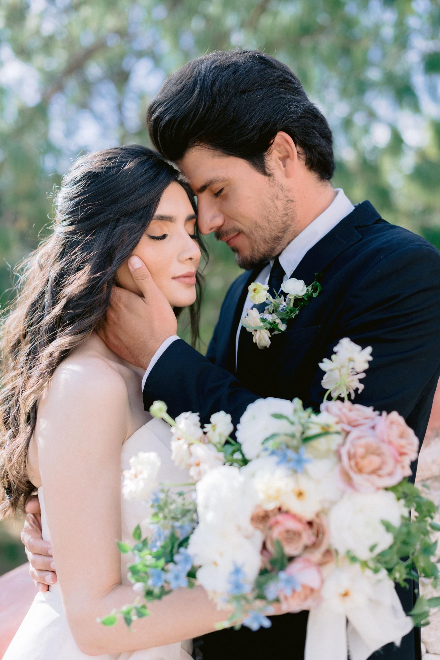 Bride-and-groom-leaning-foreheads-in-Rancho-Las-Sabinas-in-San-Miguel-de-Allende.jpg